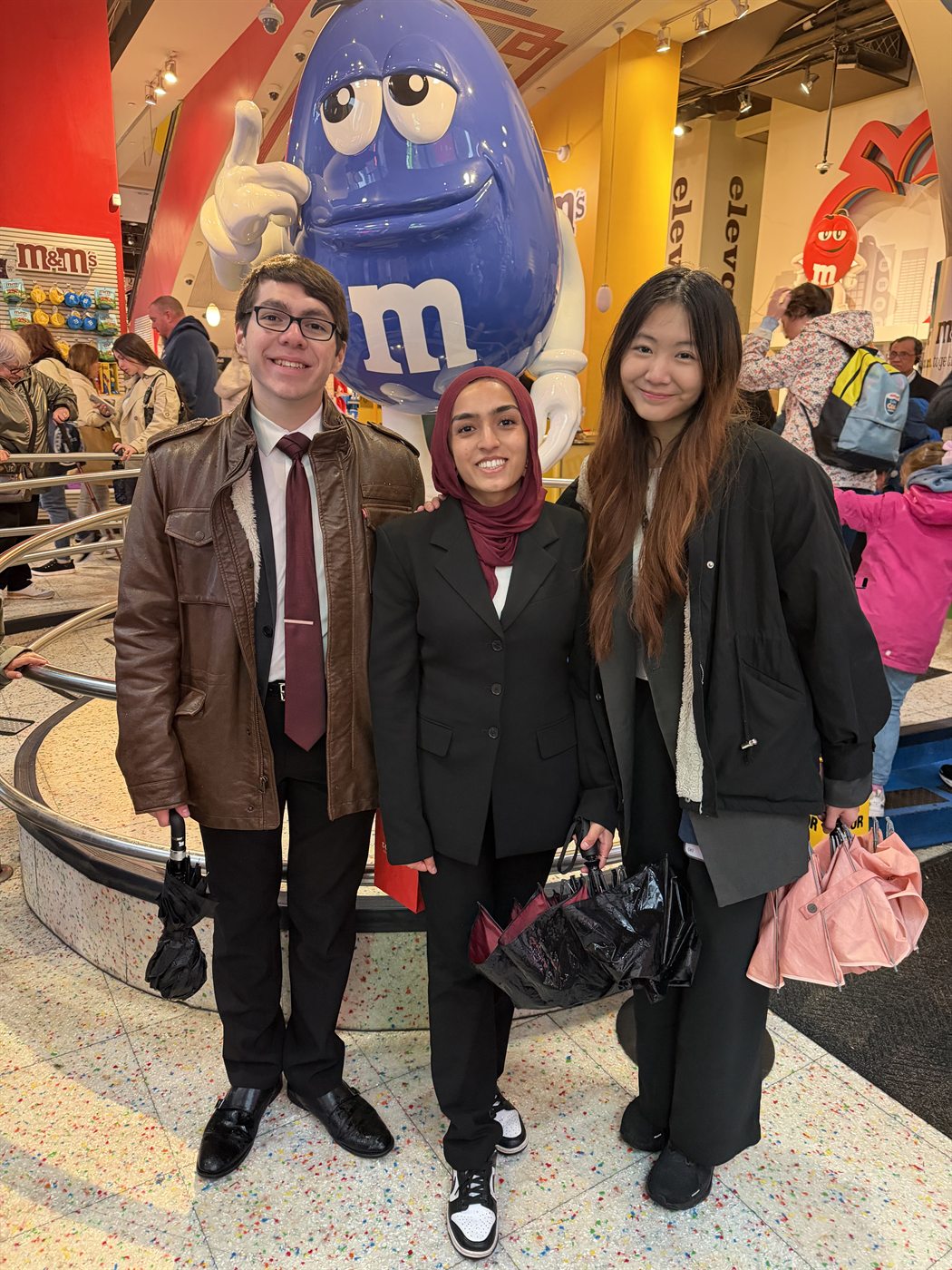 Three Harvard Moot Court members in a store in New York City between rounds.